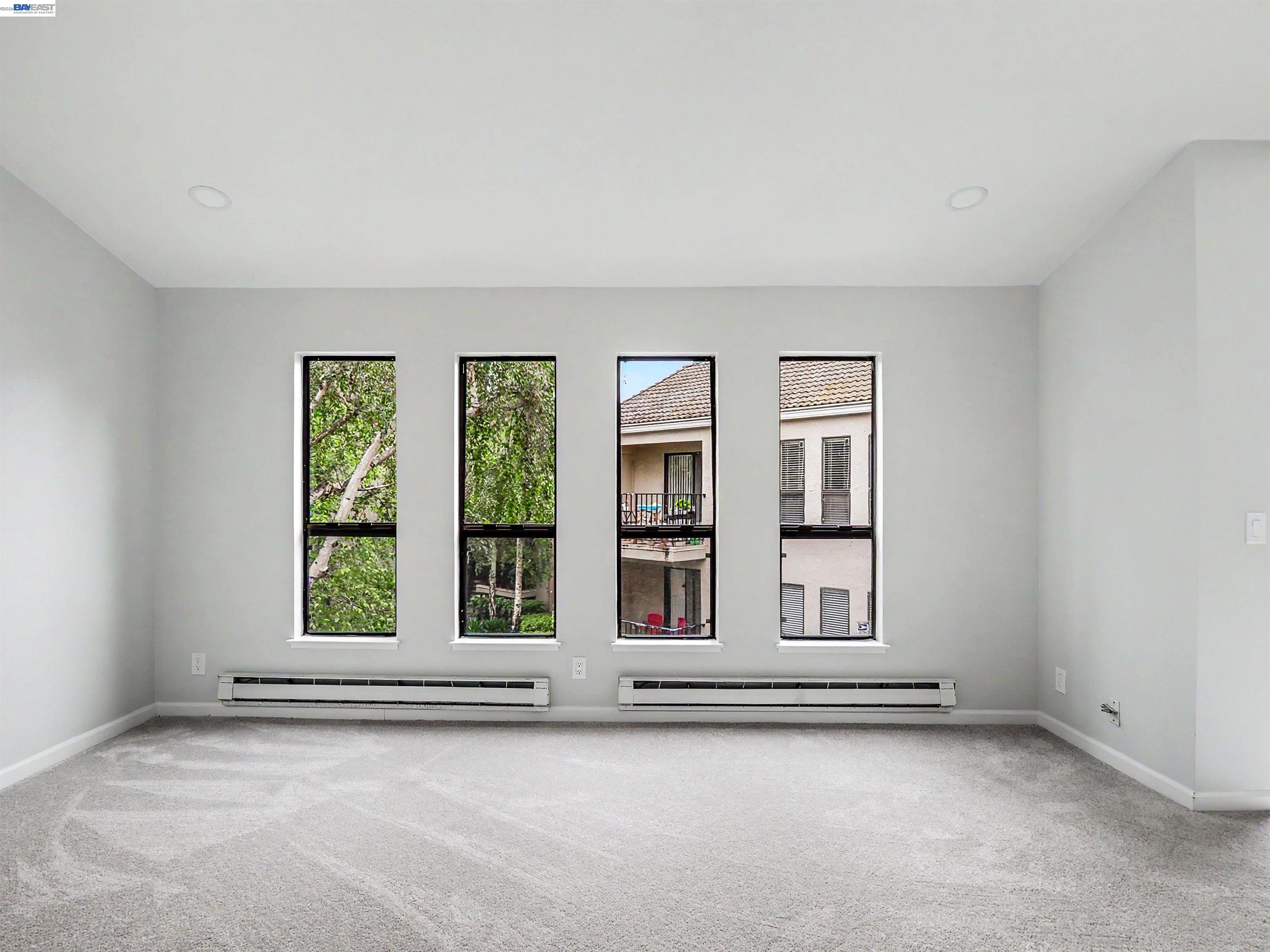 39450 Albany Common, Unit X Fremont, CA 94538 - Photo 4 of 46 a view of an empty room with window