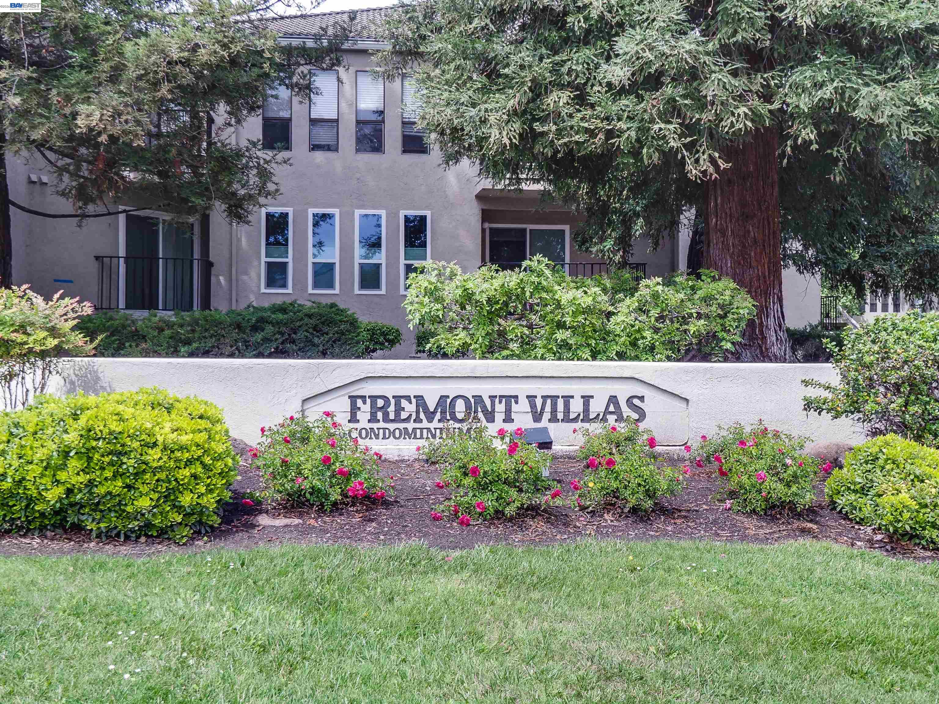 39450 Albany Common, Unit X Fremont, CA 94538 - Photo 45 of 46 a view of sign board with flower around
