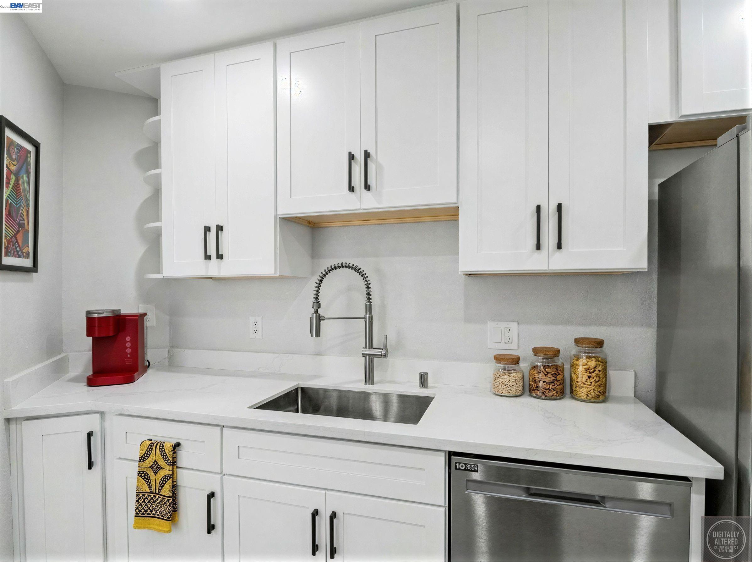 39450 Albany Common, Unit X Fremont, CA 94538 - Photo 9 of 46 a kitchen with stainless steel appliances granite countertop a sink dishwasher and cabinets with wooden floor