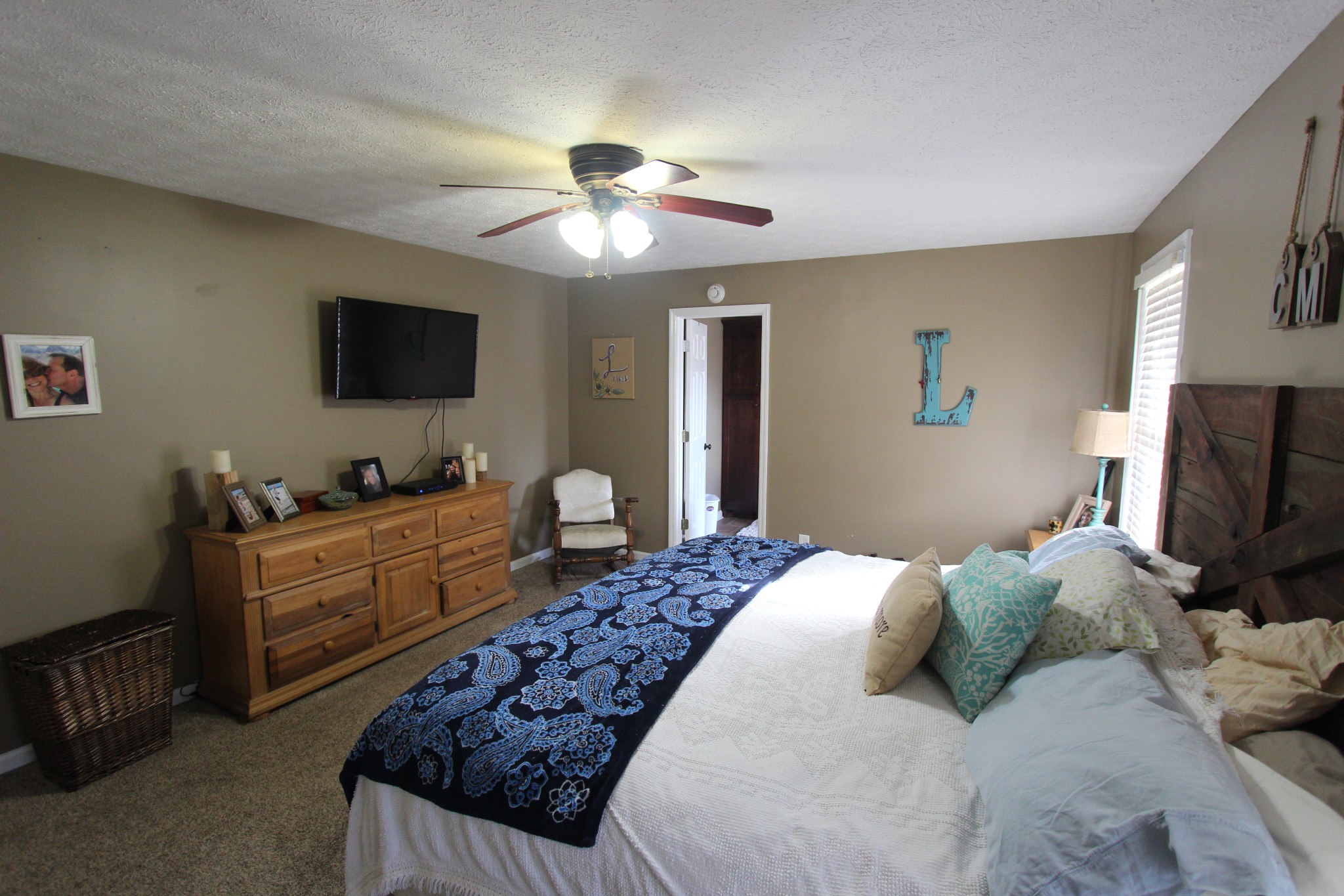 1360 Cedar Grove Road Lebanon, TN 37087 - Photo 22 of 29 a bedroom with a large bed and a flat screen tv
