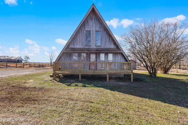 a wooden deck with a yard