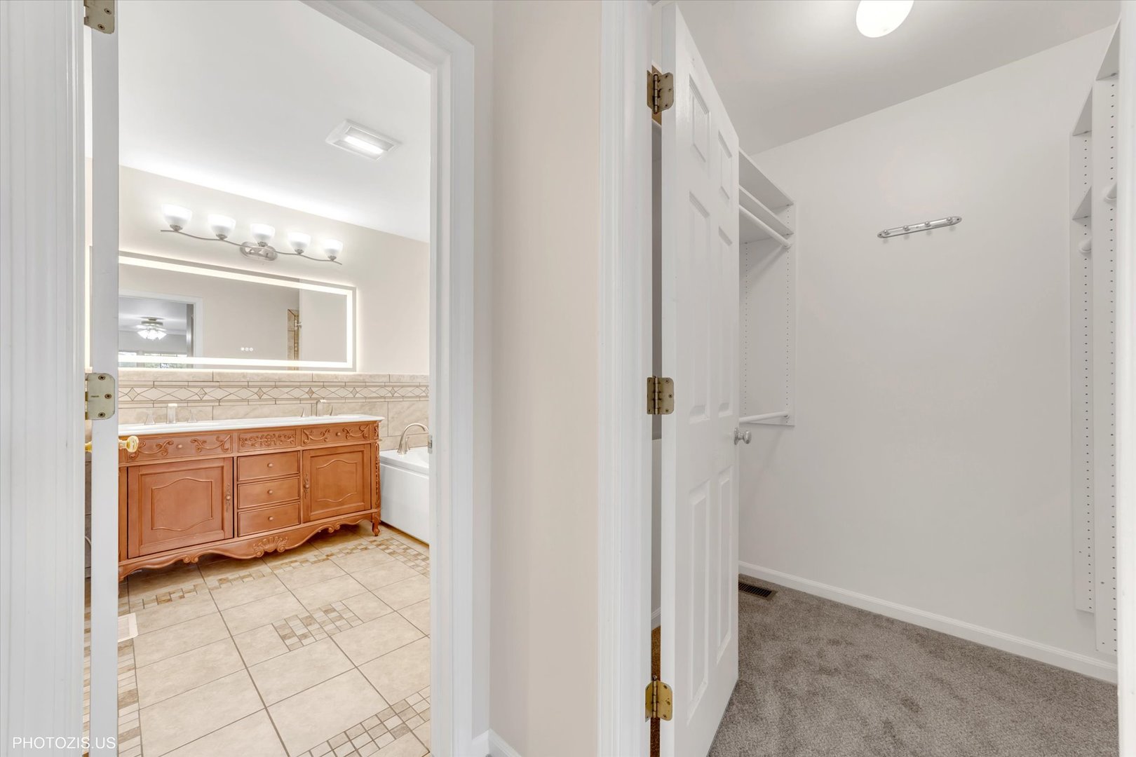 1034 Heather Court Fox River Grove, IL 60021 - Photo 24 of 64 a bathroom with a mirror and a sink