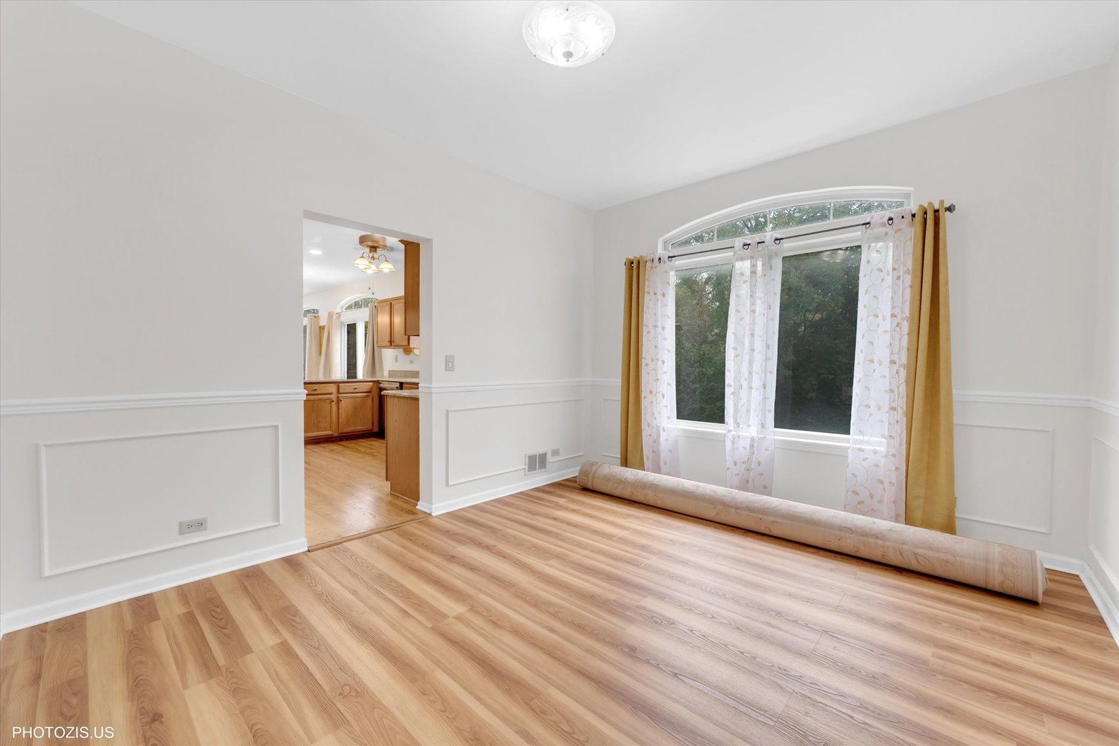 1034 Heather Court Fox River Grove, IL 60021 - Photo 5 of 64 a view of empty room with wooden floor and fan