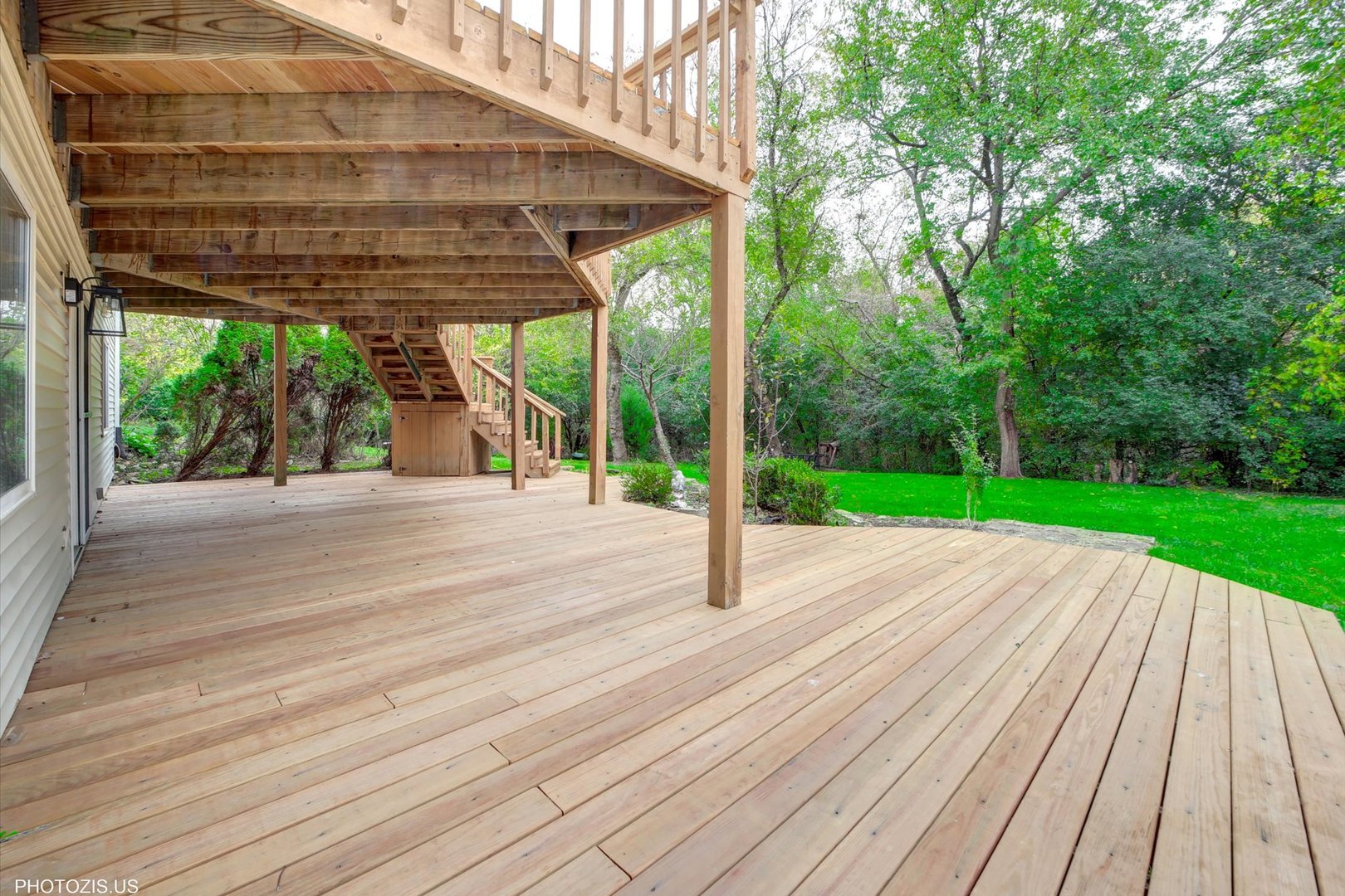1034 Heather Court Fox River Grove, IL 60021 - Photo 52 of 64 a view of a patio with table and chairs a barbeque with wooden floor and fence