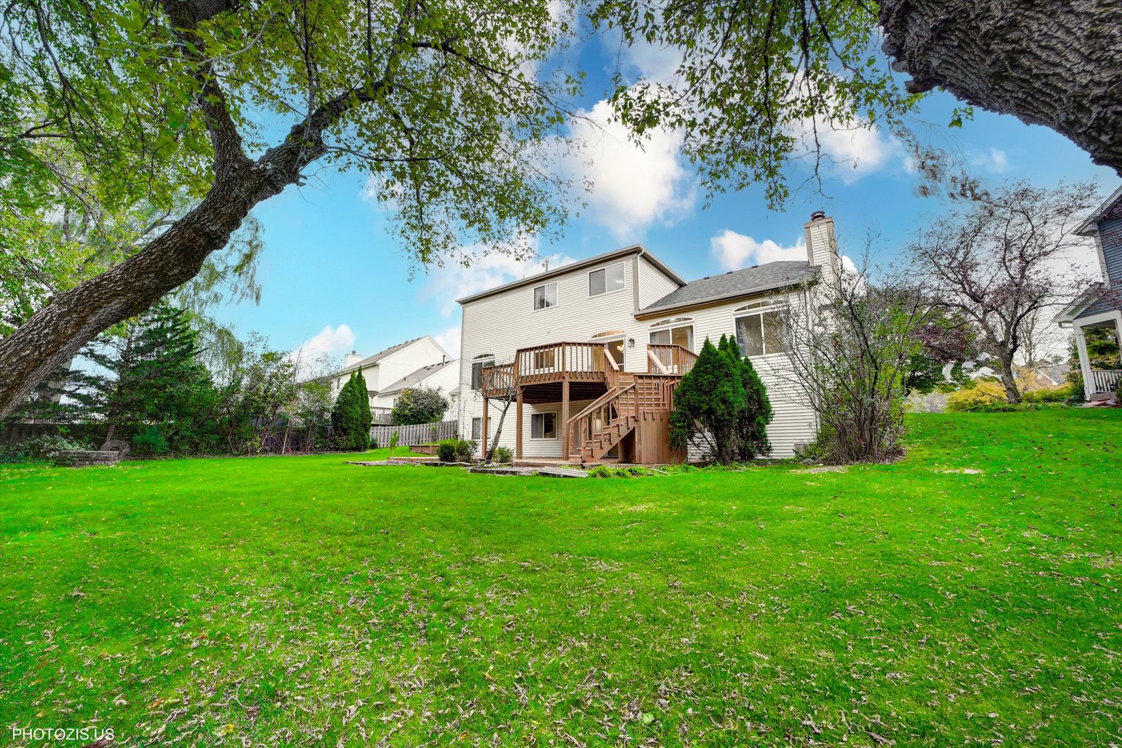 1034 Heather Court Fox River Grove, IL 60021 - Photo 57 of 64 a view of a house with a big yard and large trees