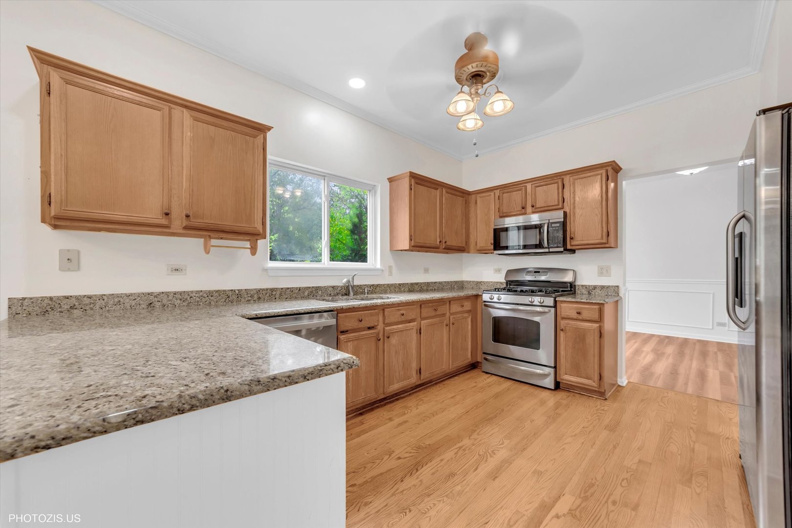 1034 Heather Court Fox River Grove, IL 60021 - Photo 6 of 64 a kitchen with stainless steel appliances granite countertop a stove sink microwave and refrigerator