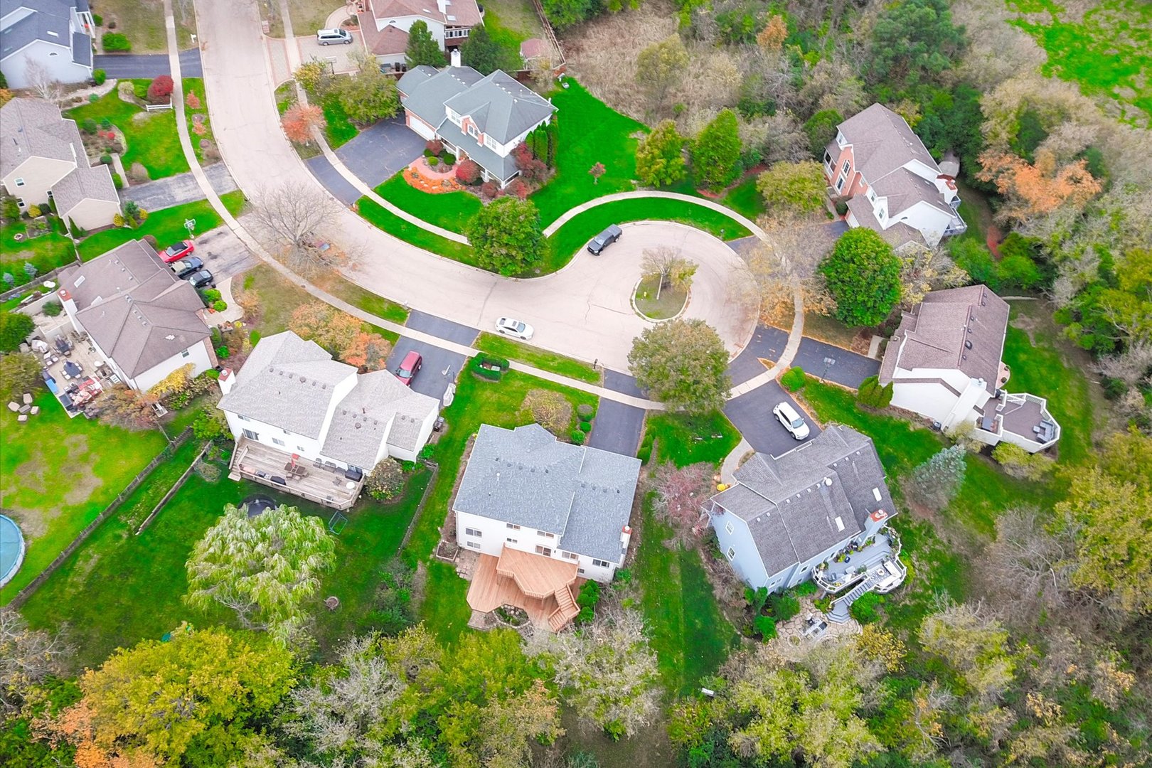 1034 Heather Court Fox River Grove, IL 60021 - Photo 63 of 64 an aerial view of a house with a garden and swimming pool