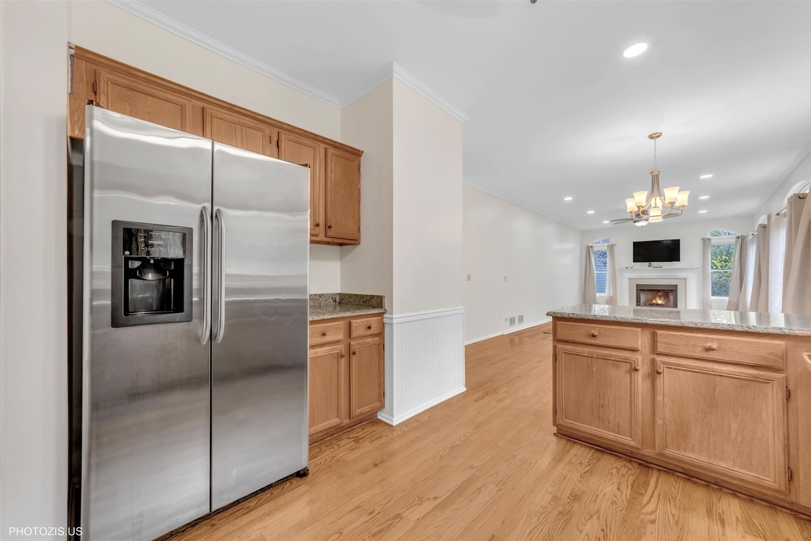 1034 Heather Court Fox River Grove, IL 60021 - Photo 8 of 64 a large kitchen with stainless steel appliances kitchen island granite countertop a refrigerator and a sink