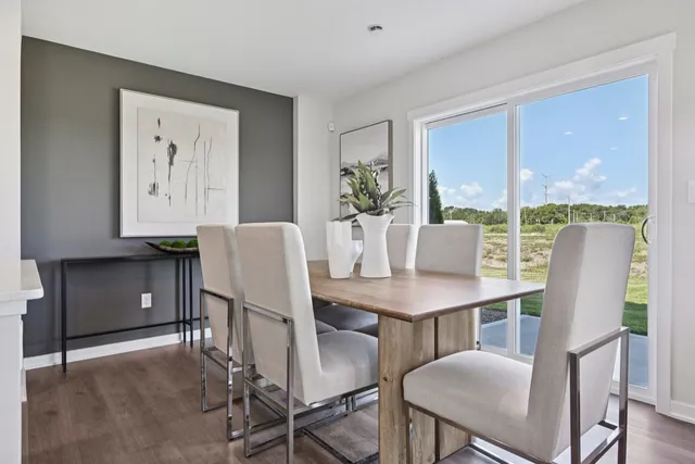 a view of a dining room with furniture window and outside view