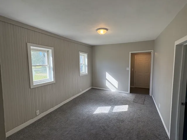 a view of empty room with windows