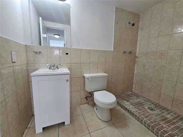 a view of a house with backyard and a large window