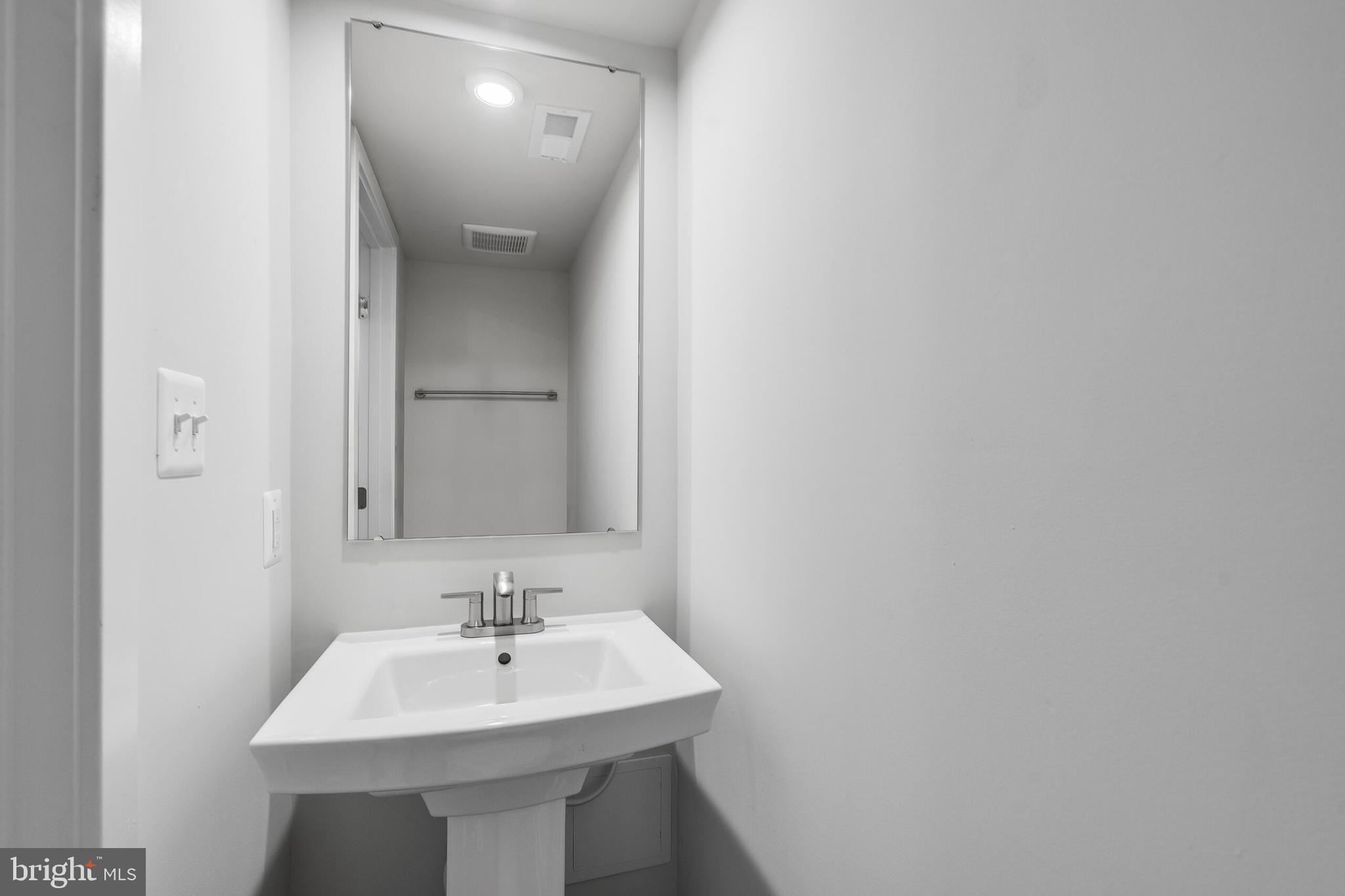 8515 Branch Side Way, Unit ST2001B Brandywine, MD 20613 - Photo 5 of 31 MAIN LEVEL POWDER ROOM