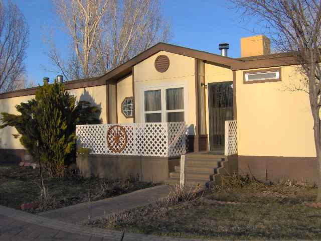 396 Paramount Court Reno, NV 89506 - Photo 1 of 9 a front view of a house with a yard