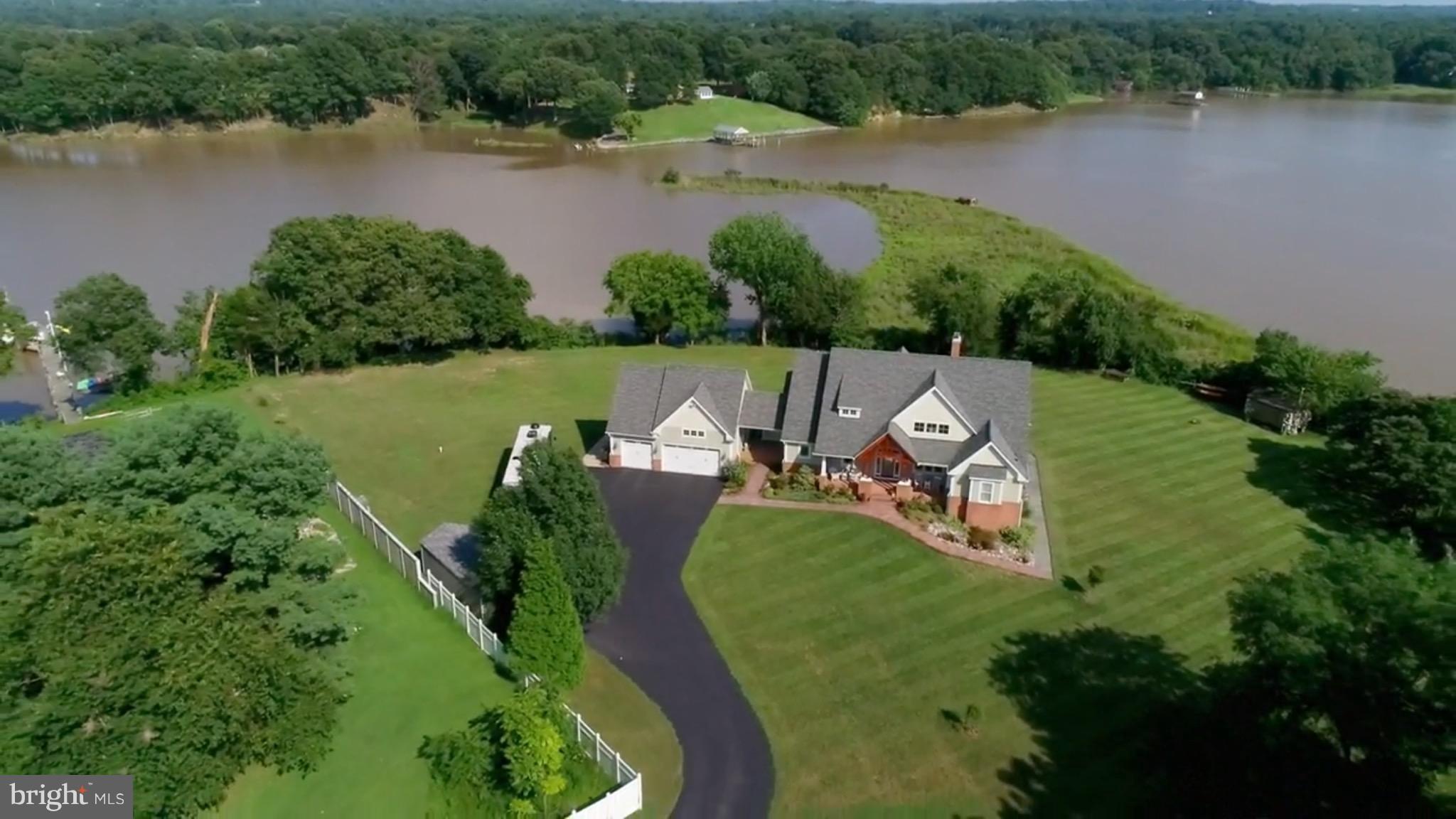 3380 Soper Road Huntingtown, MD 20639 - Photo 1 of 28 an aerial view of a house with outdoor space and lake view