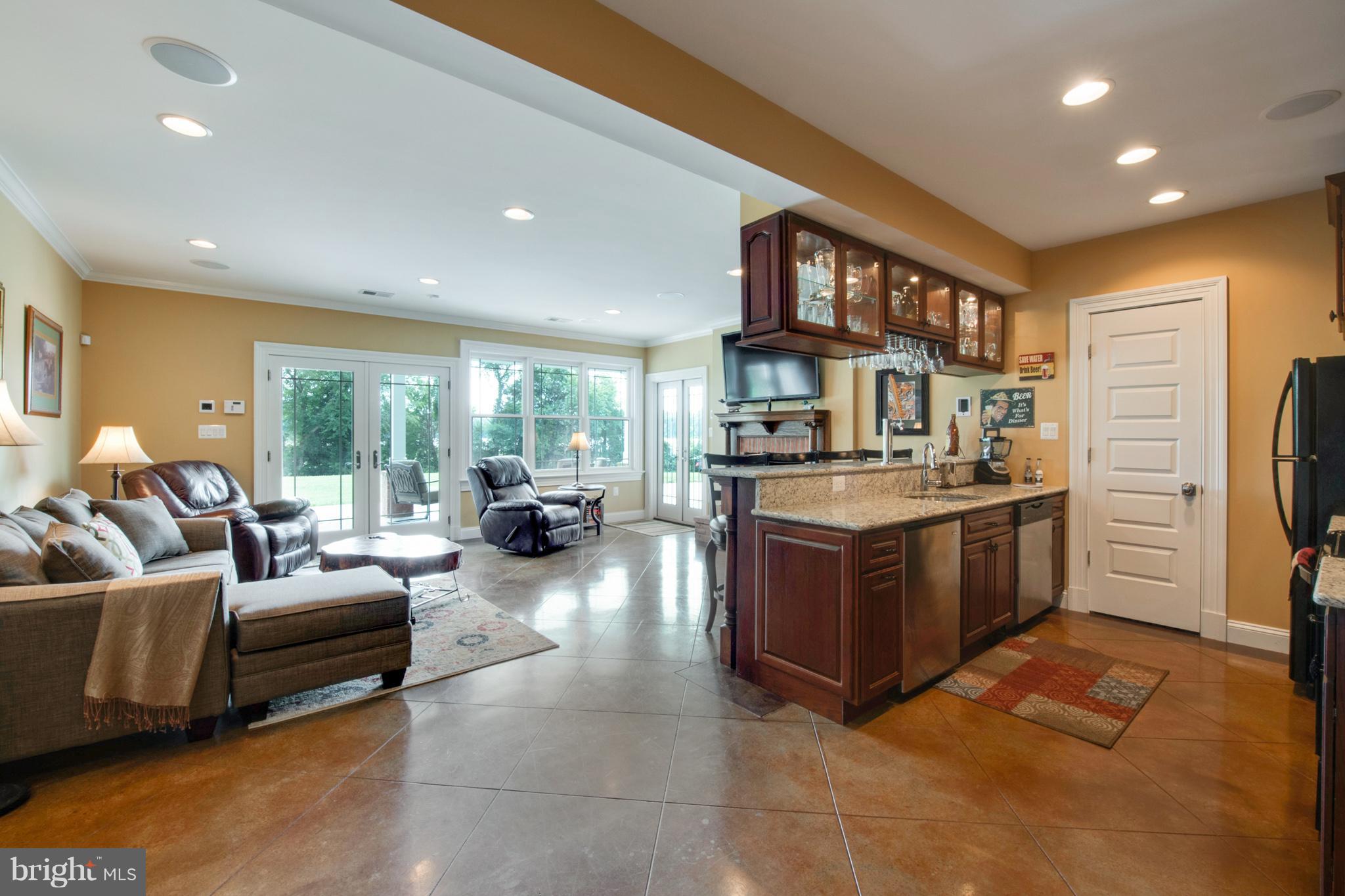 3380 Soper Road Huntingtown, MD 20639 - Photo 12 of 28 a large room with a large window and furniture