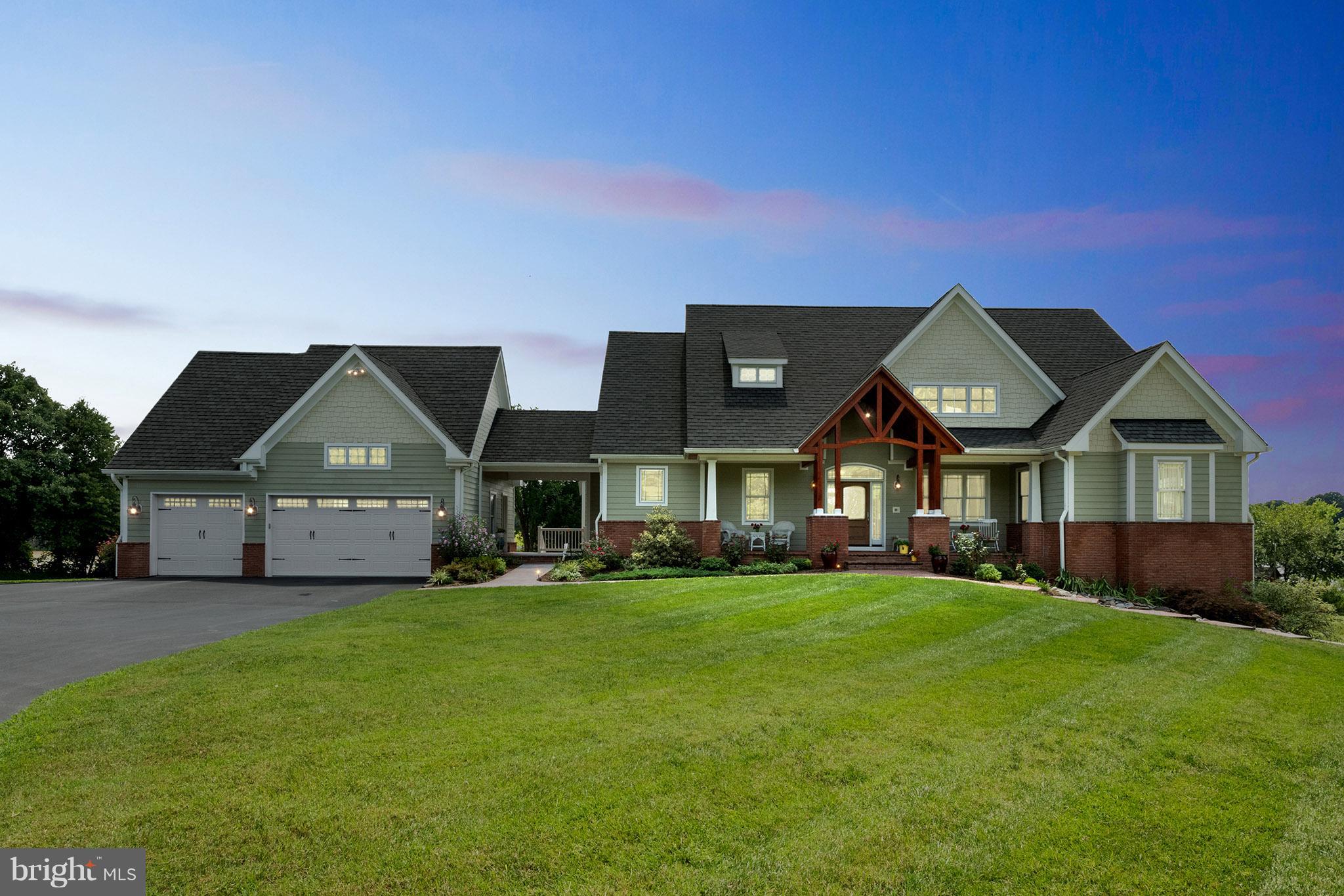 3380 Soper Road Huntingtown, MD 20639 - Photo 3 of 28 a front view of a house with a garden
