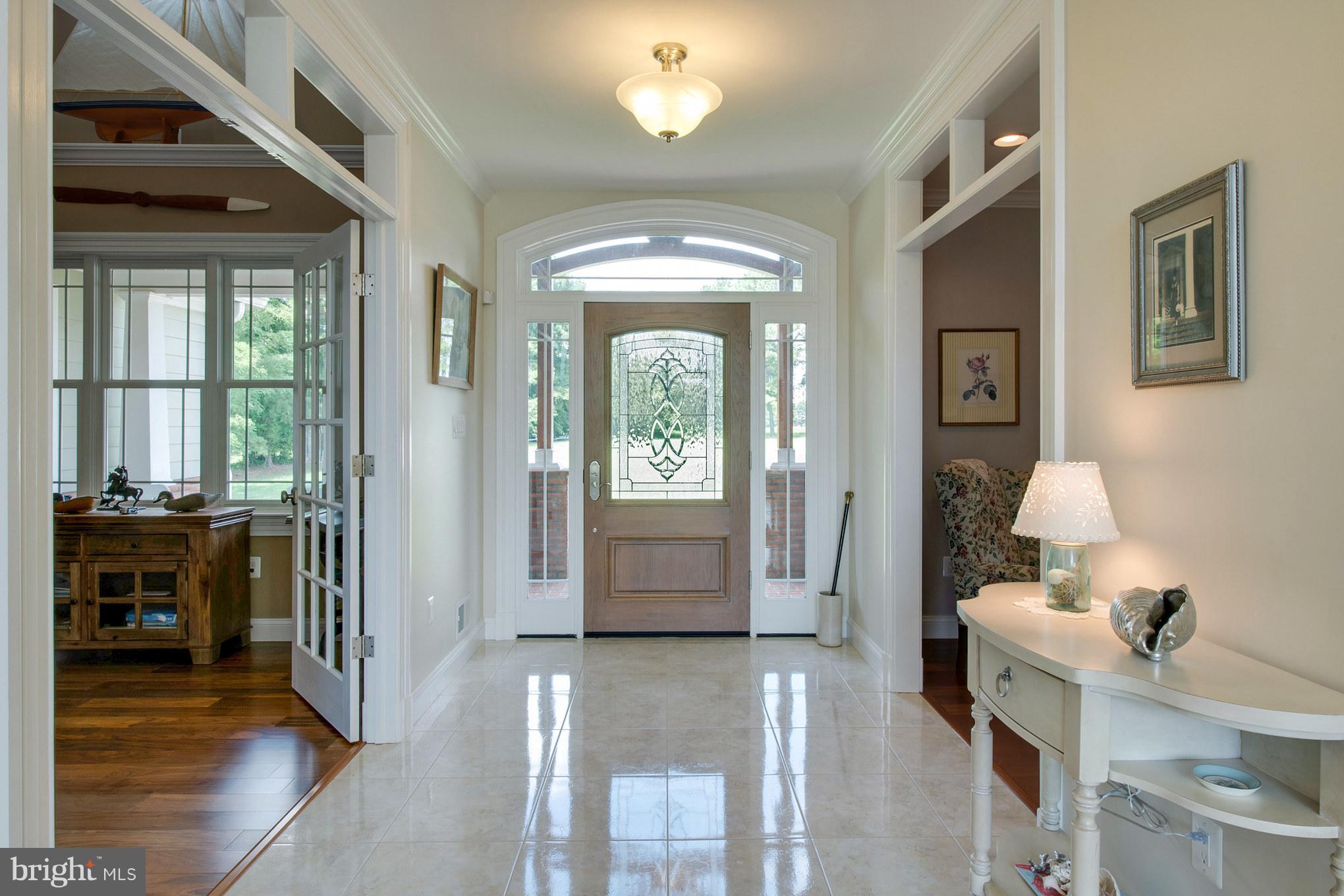 3380 Soper Road Huntingtown, MD 20639 - Photo 4 of 28 a hallway with a window and wooden floor