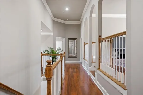 a bedroom with a bed and a ceiling fan
