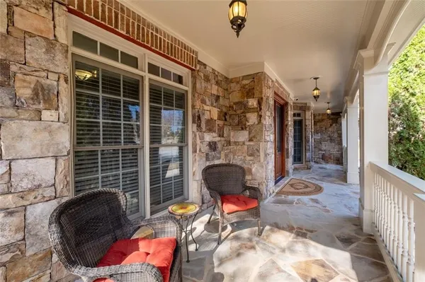 a living room with furniture rug and window