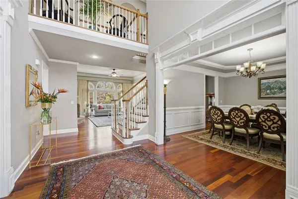 a living room with furniture large window and a fireplace