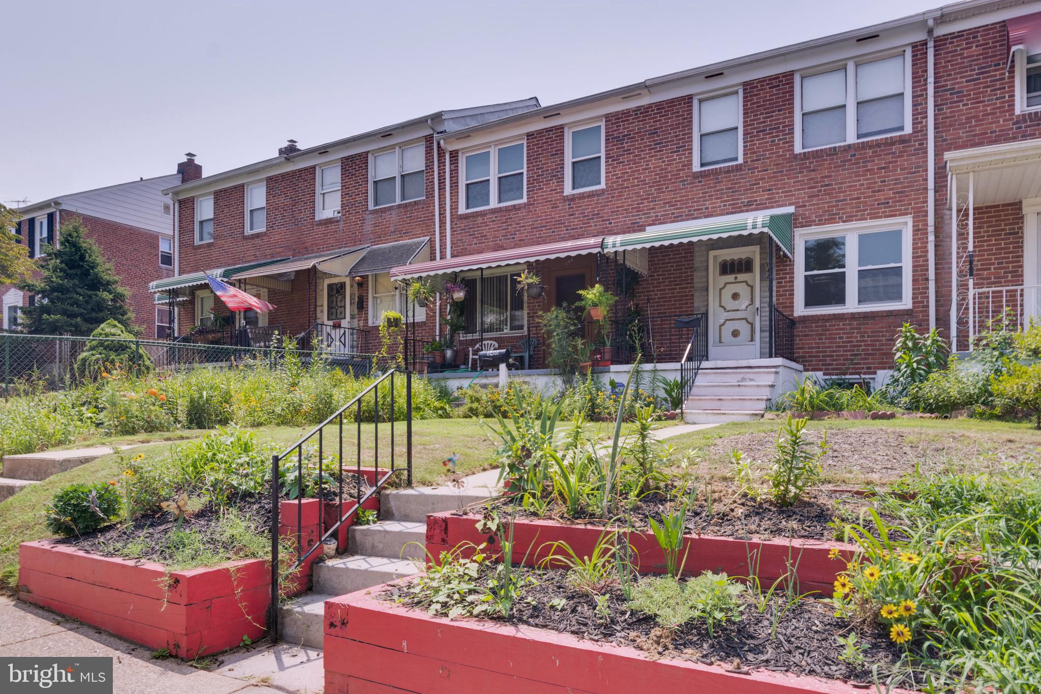 148 Wiltshire Road Baltimore, MD 21221 - Photo 2 of 28 front view of a house with a yard