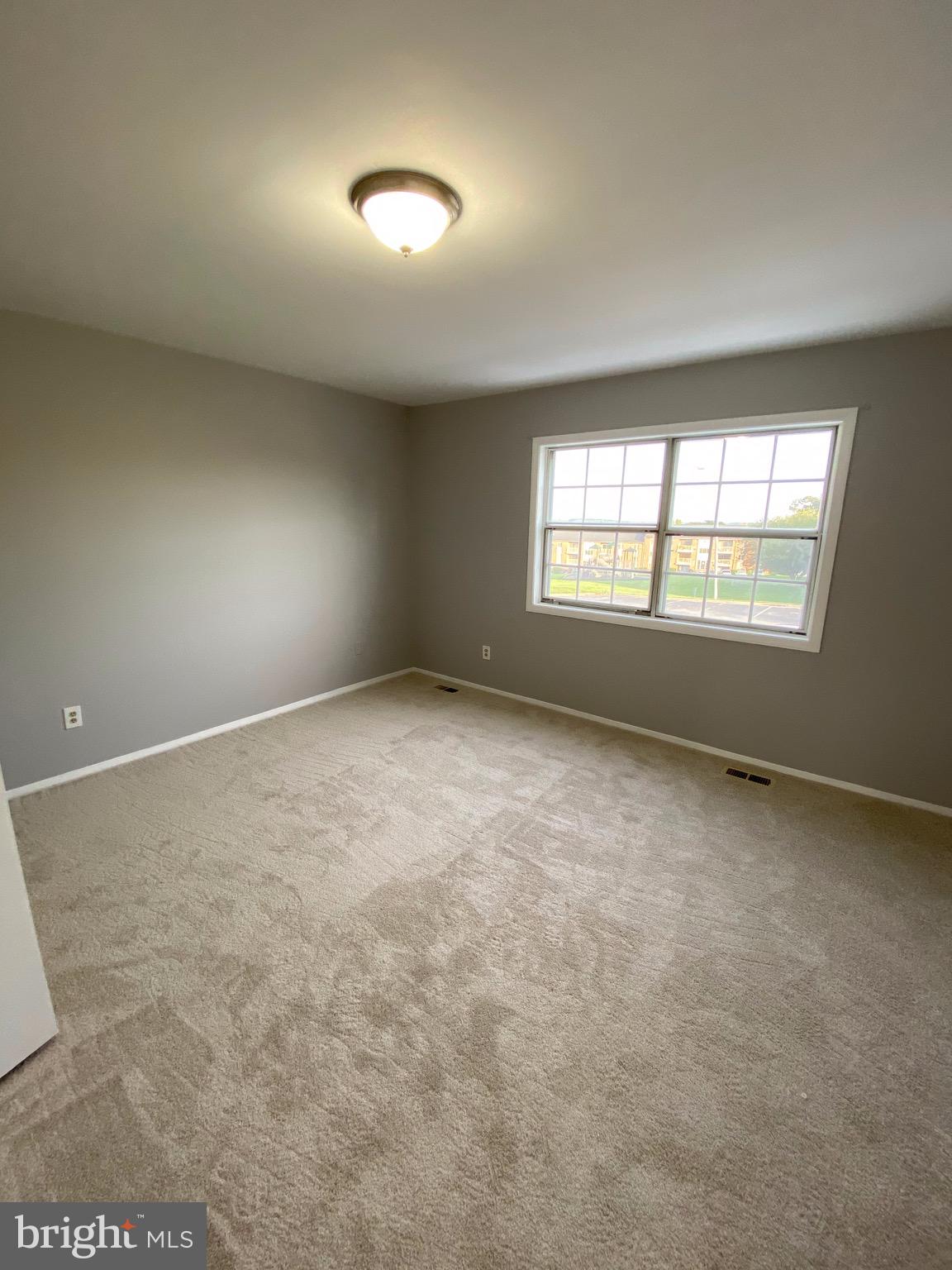 8807 Trimble Way Baltimore, MD 21237 - Photo 19 of 32 Spacious 2nd bedroom with new carpet & fresh paint