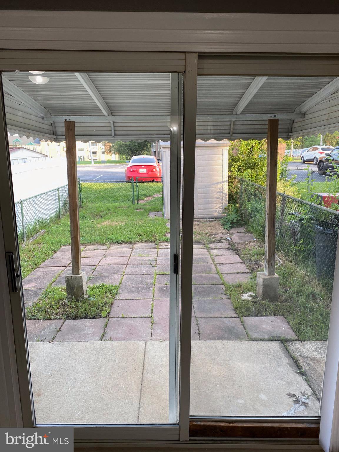 8807 Trimble Way Baltimore, MD 21237 - Photo 24 of 32 Sliding glass door leading to rear yard