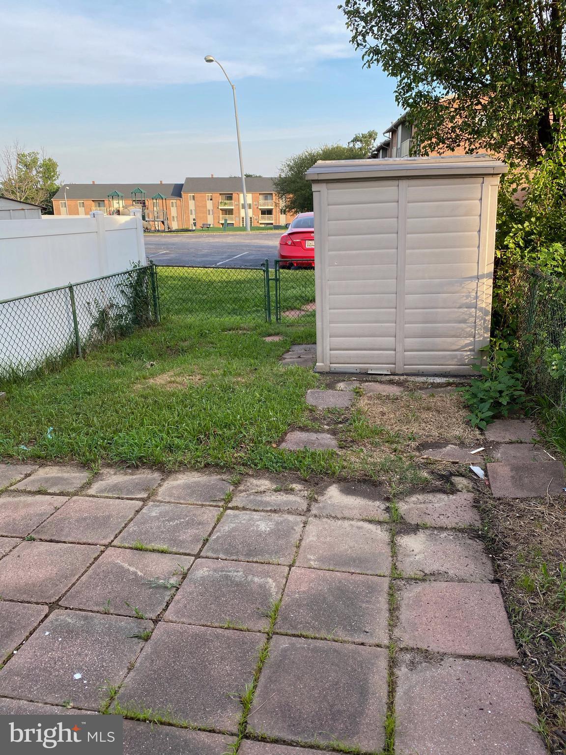 8807 Trimble Way Baltimore, MD 21237 - Photo 26 of 32 Rear yard of home with nice walk out patio