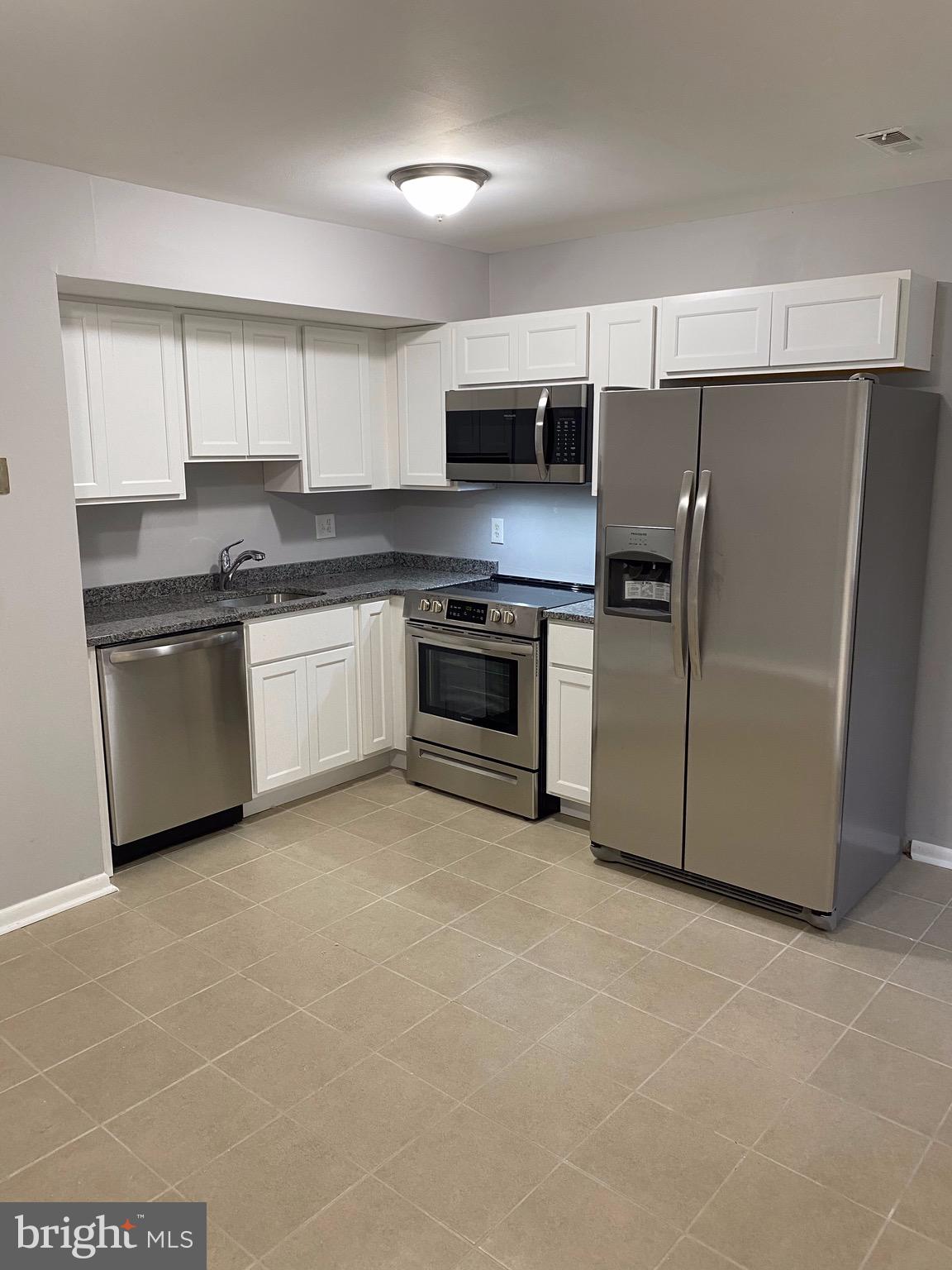 8807 Trimble Way Baltimore, MD 21237 - Photo 6 of 32 Beautiful kitchen w/ NEW SS appliances & cabinets