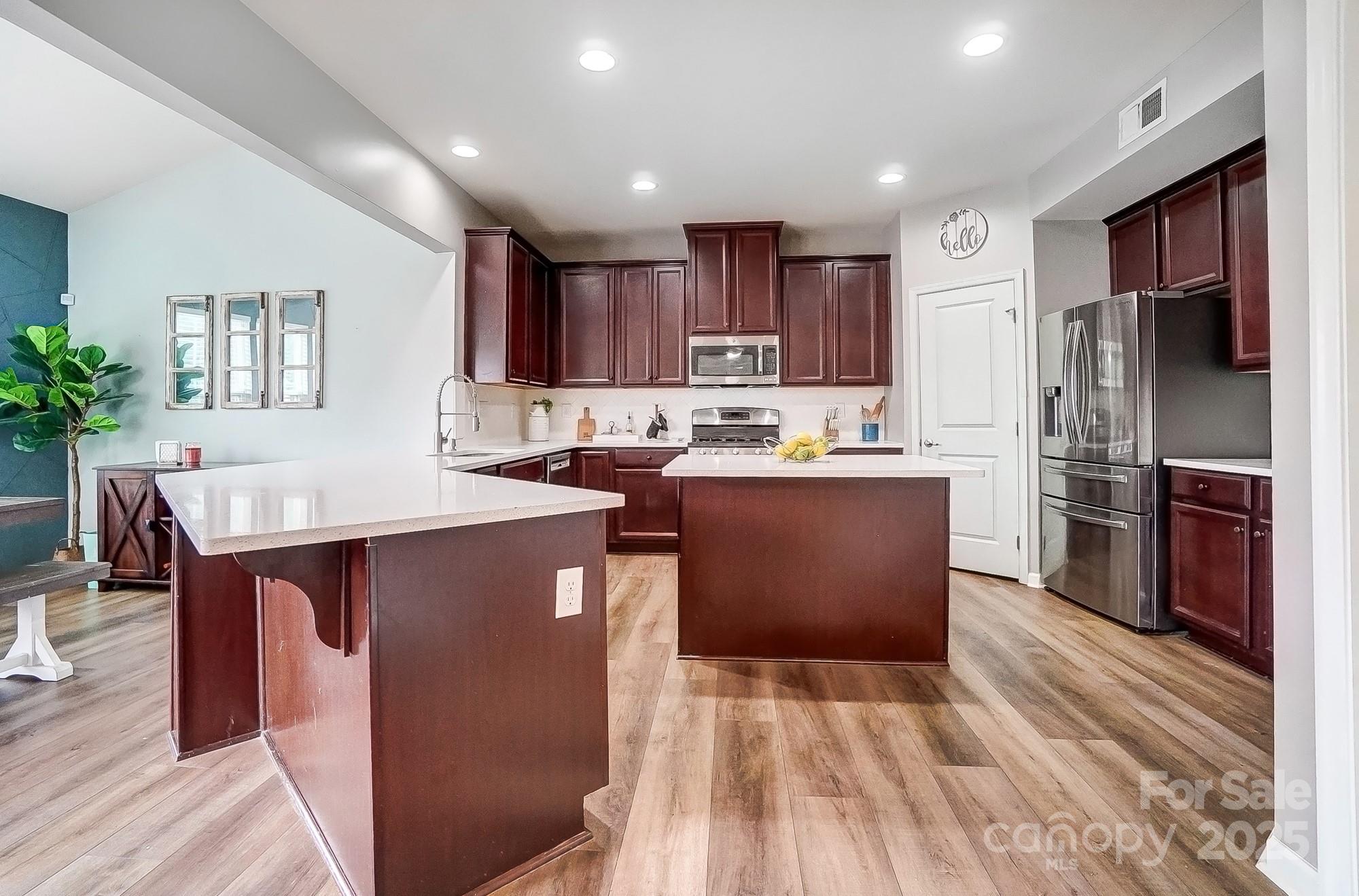 2065 Taney Way Indian Land, SC 29707 - Photo 12 of 43 a kitchen with kitchen island a sink stove and refrigerator