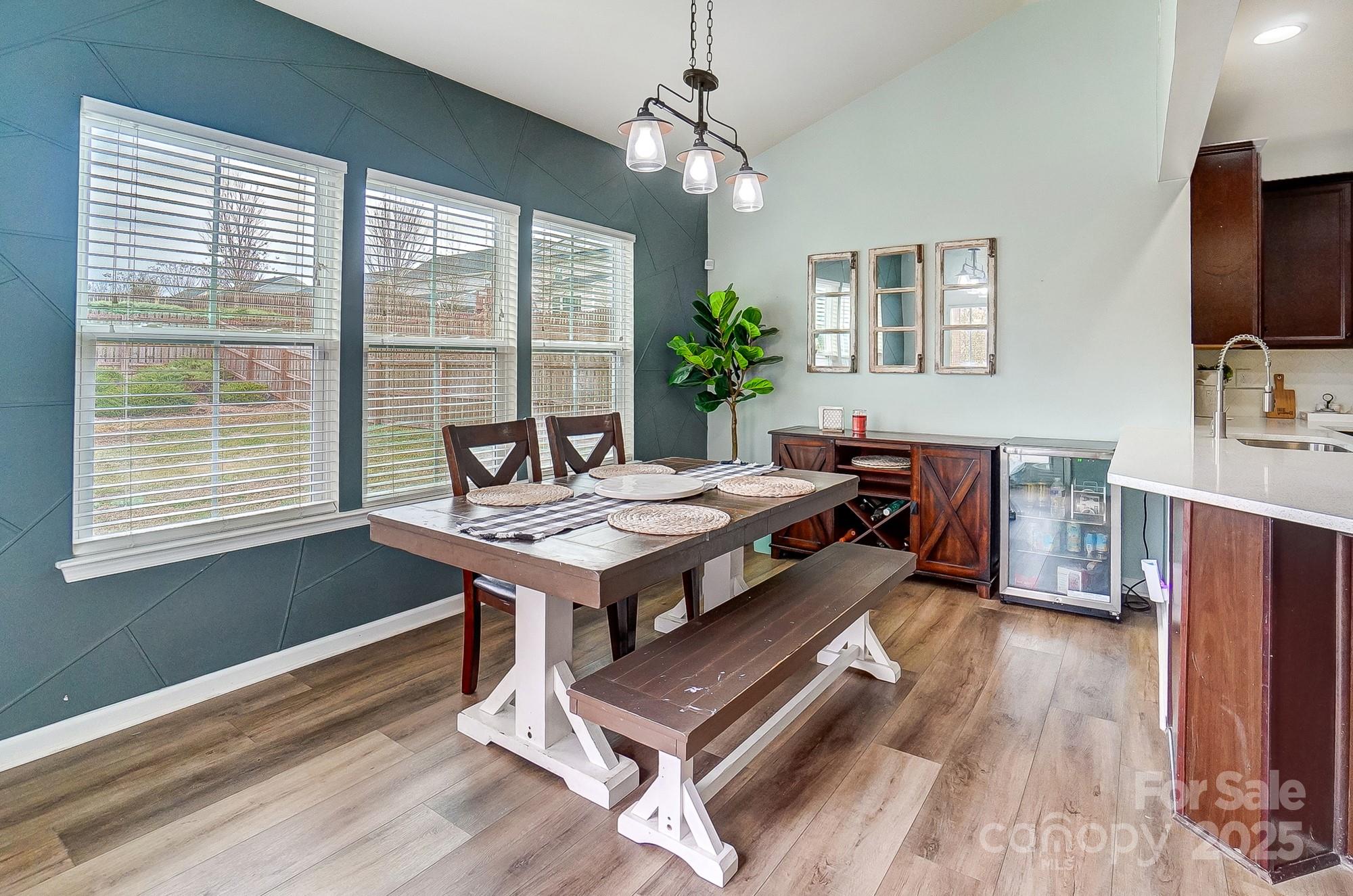 2065 Taney Way Indian Land, SC 29707 - Photo 17 of 43 a room with furniture a flat screen tv and a floor to ceiling window
