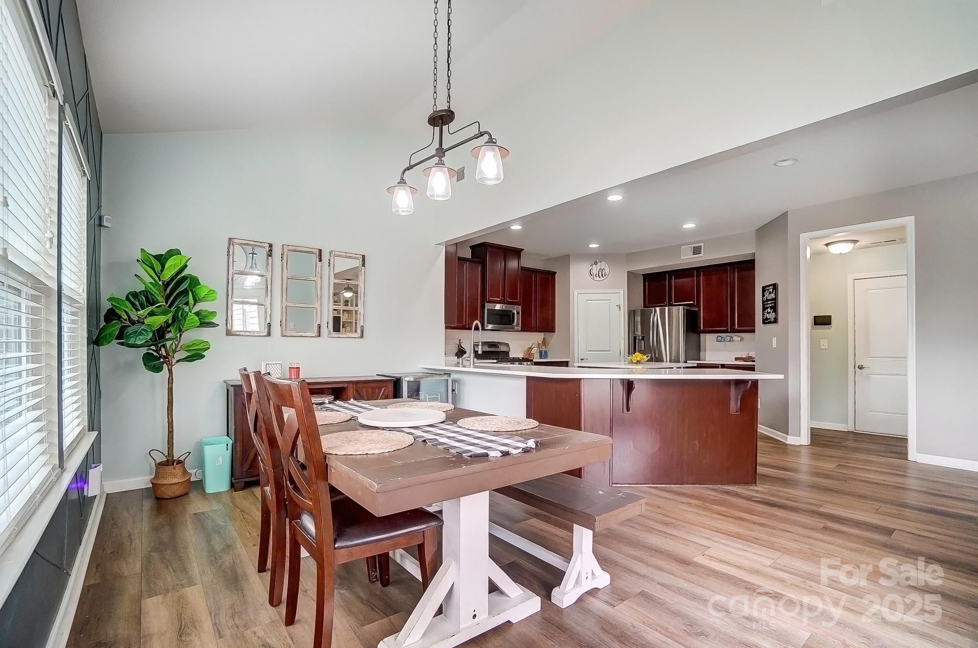2065 Taney Way Indian Land, SC 29707 - Photo 18 of 43 a view of a dining room with furniture window and wooden floor