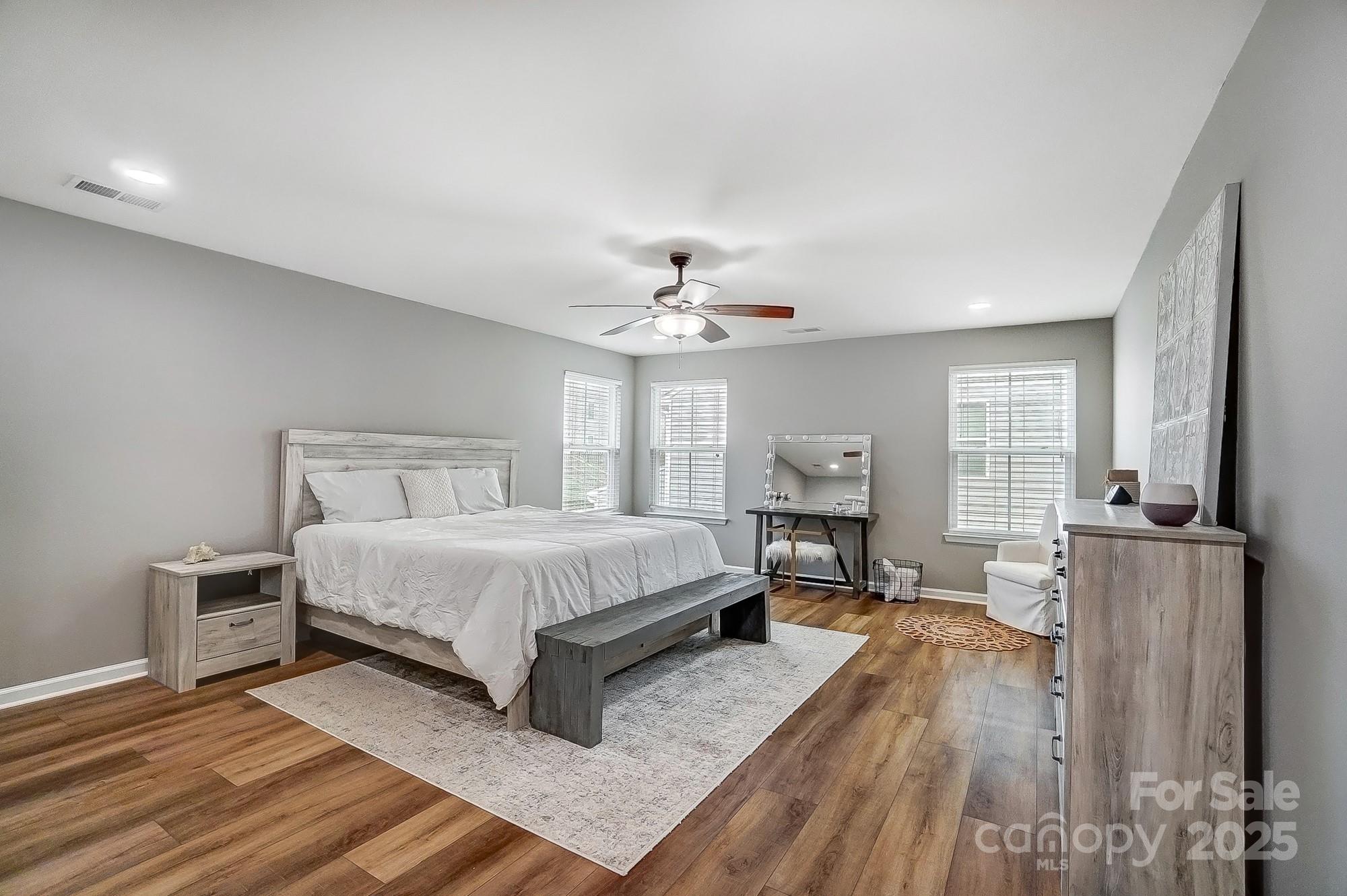 2065 Taney Way Indian Land, SC 29707 - Photo 25 of 43 a spacious bedroom with a bed and wooden floor