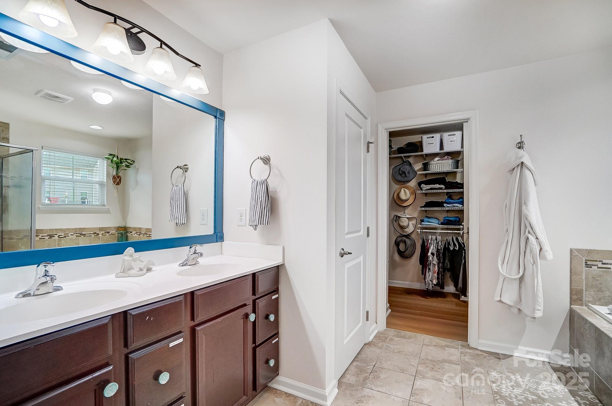 2065 Taney Way Indian Land, SC 29707 - Photo 28 of 43 a bathroom with a double vanity sink a toilet and shower