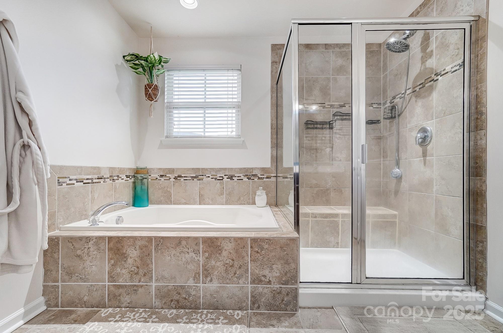 2065 Taney Way Indian Land, SC 29707 - Photo 29 of 43 a bathroom with a bathtub and a shower
