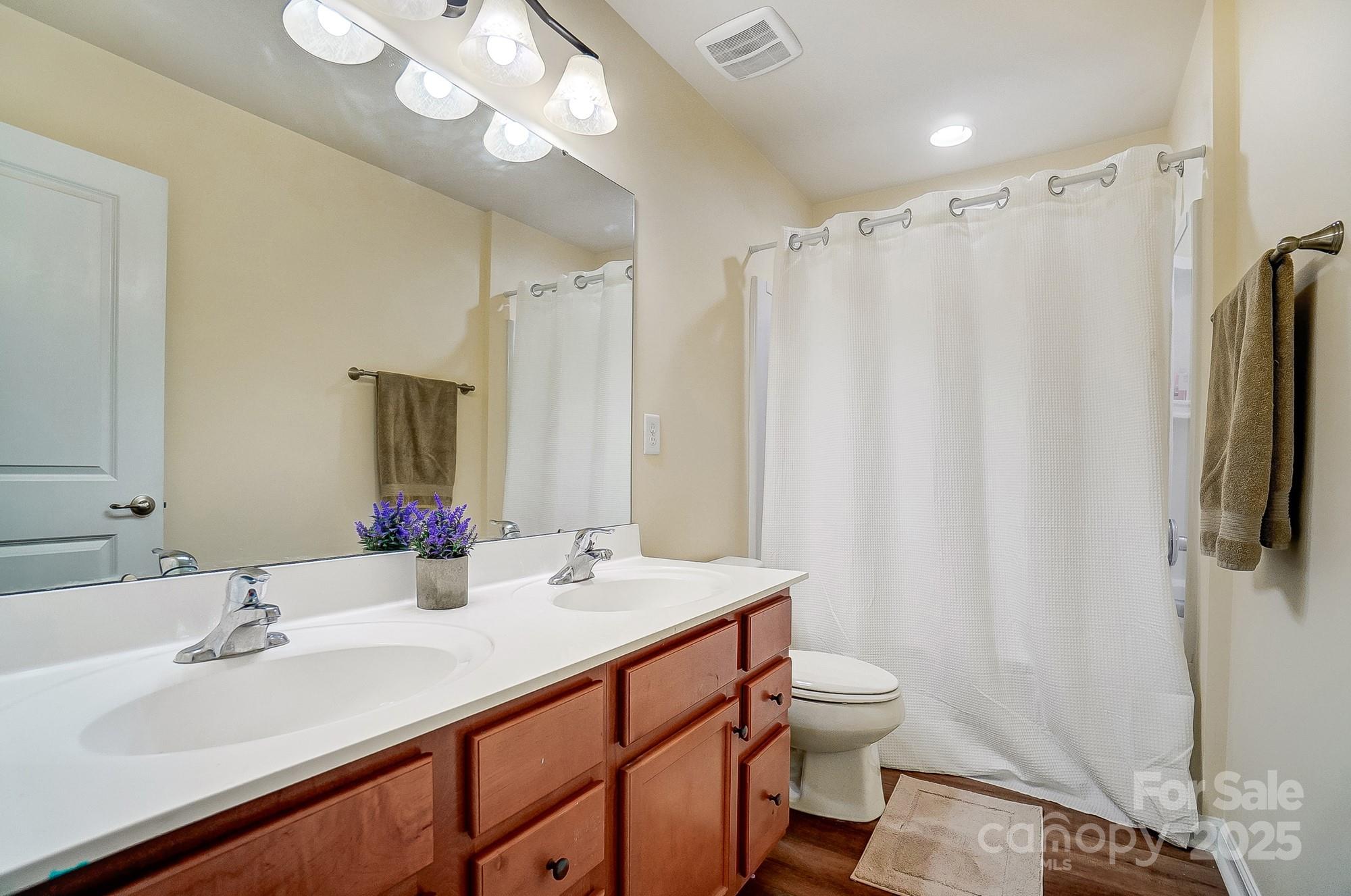 2065 Taney Way Indian Land, SC 29707 - Photo 32 of 43 a bathroom with a double vanity sink mirror and toilet