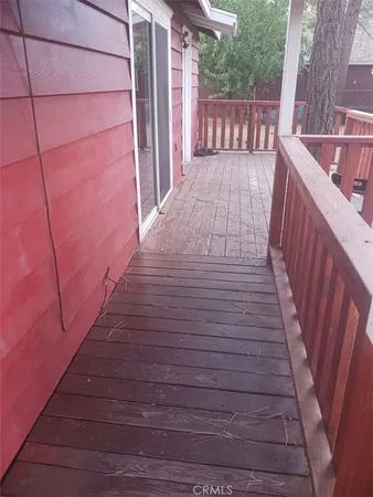 a balcony with wooden floor