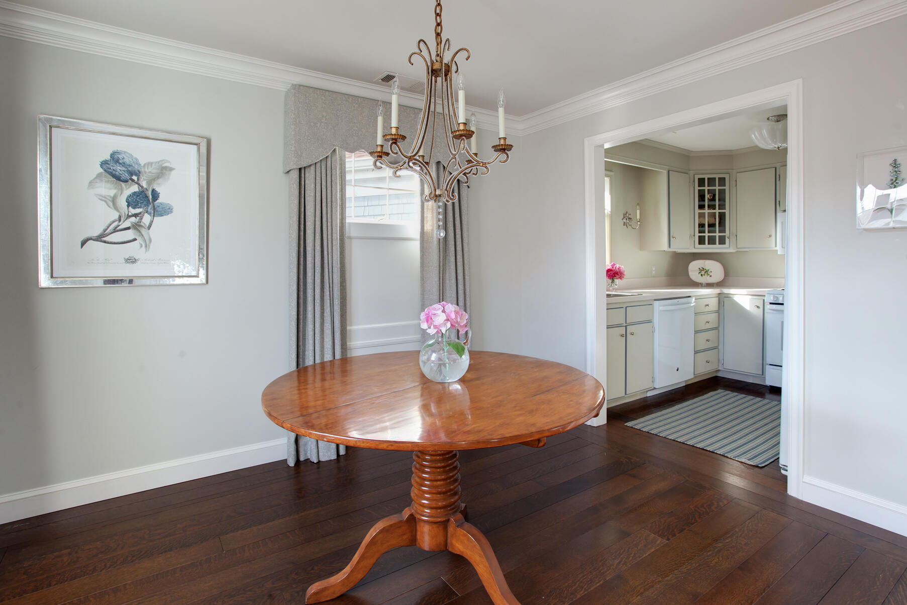 39 Tower Hill Road, Unit 16C Osterville, MA 02655 - Photo 13 of 42 a view of a dining room with furniture wooden floor and a chandelier