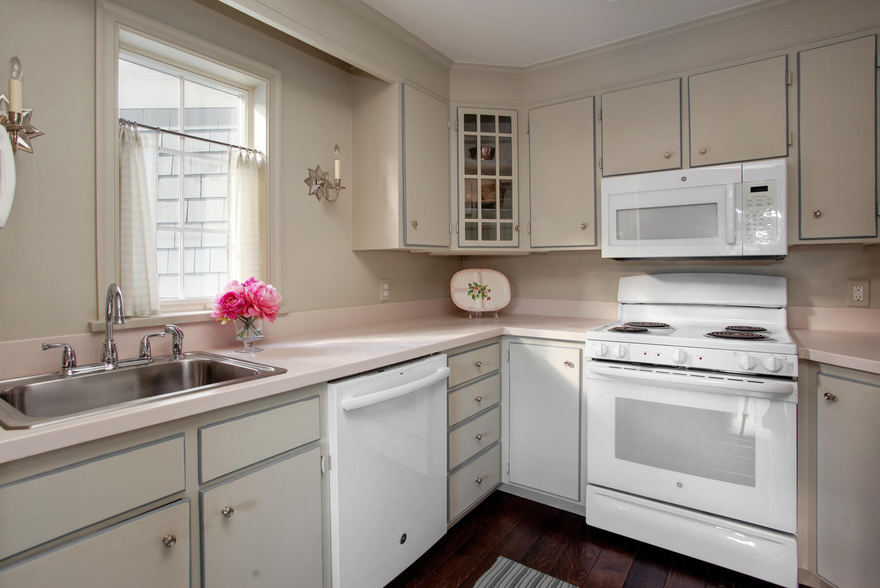 39 Tower Hill Road, Unit 16C Osterville, MA 02655 - Photo 15 of 42 a kitchen with cabinets appliances a sink and a window