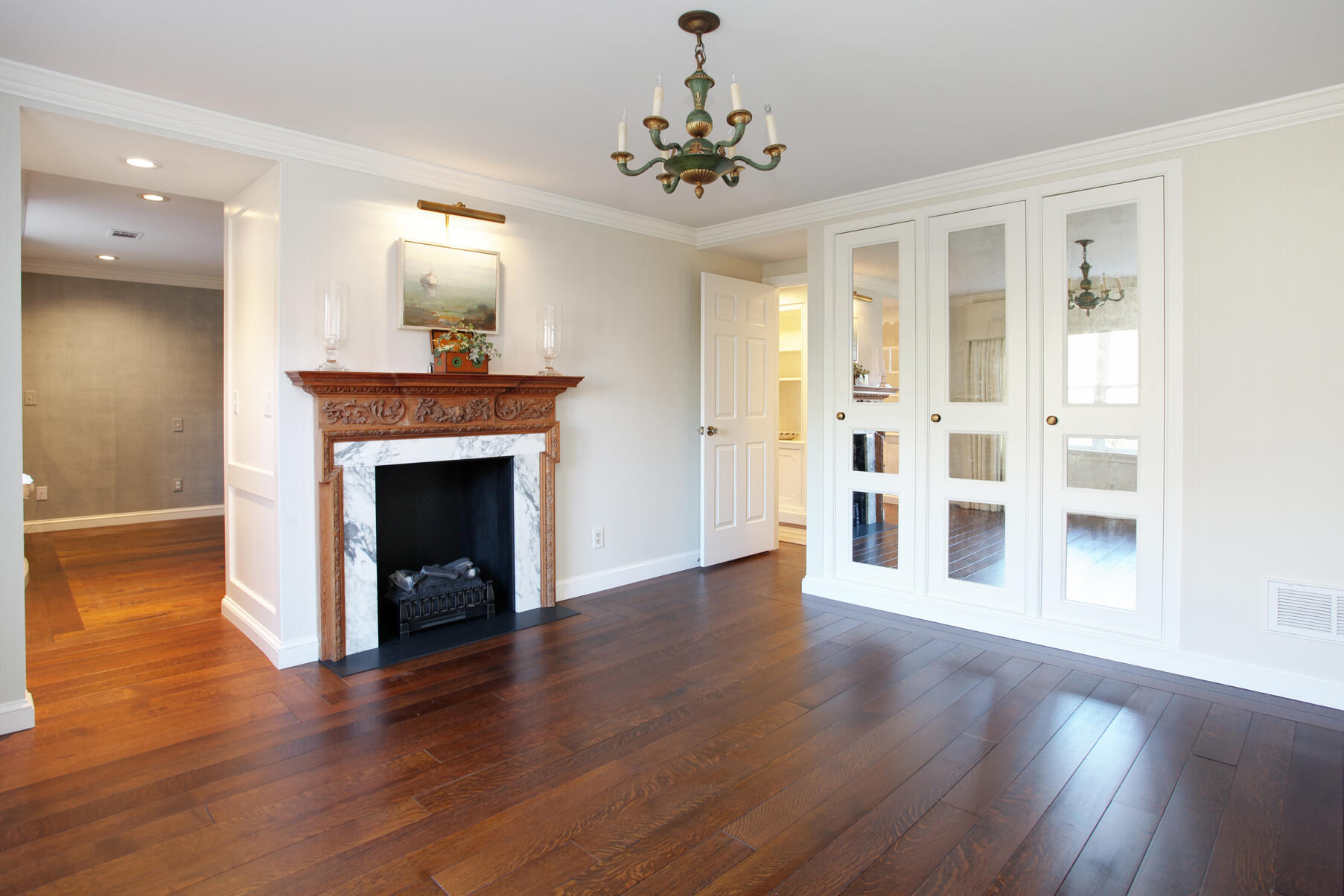 39 Tower Hill Road, Unit 16C Osterville, MA 02655 - Photo 20 of 42 a view of an empty room with wooden floor and a fireplace