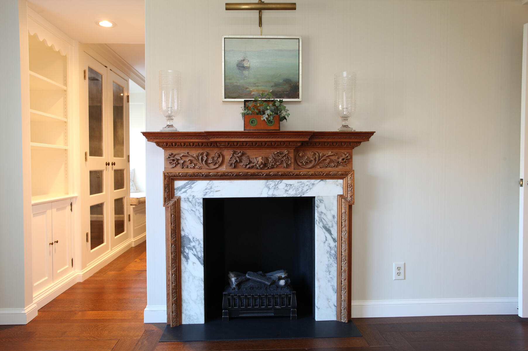 39 Tower Hill Road, Unit 16C Osterville, MA 02655 - Photo 23 of 42 a living room with a fireplace and wooden floor