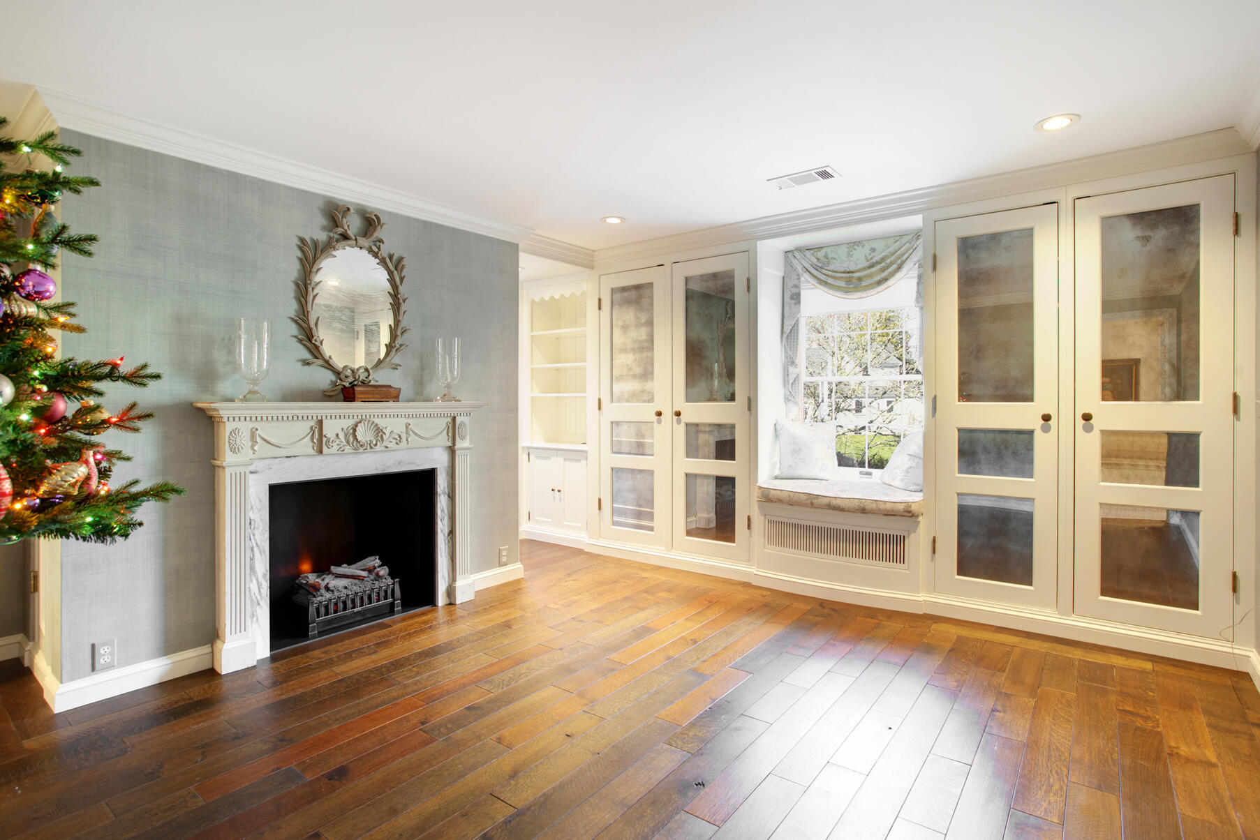 39 Tower Hill Road, Unit 16C Osterville, MA 02655 - Photo 26 of 42 a living room with wooden floors and a fireplace