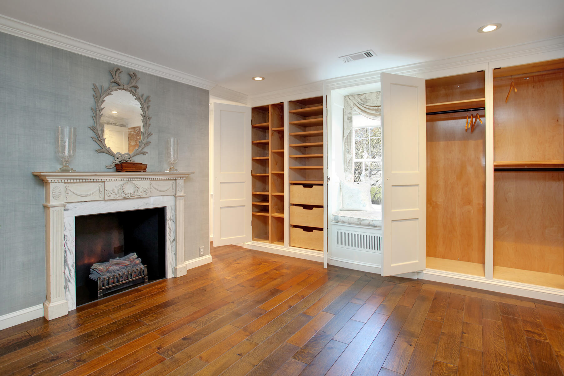 39 Tower Hill Road, Unit 16C Osterville, MA 02655 - Photo 27 of 42 a view of an empty room with wooden floor fireplace and a window