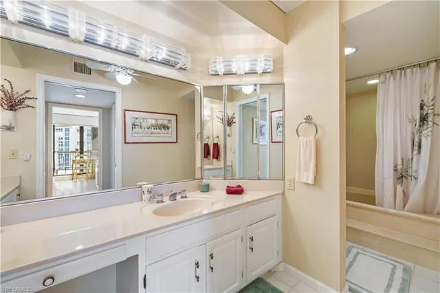 a bathroom with a sink double vanity and a mirror