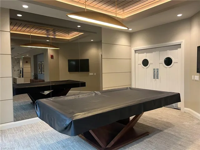 a kitchen with a sink and a refrigerator