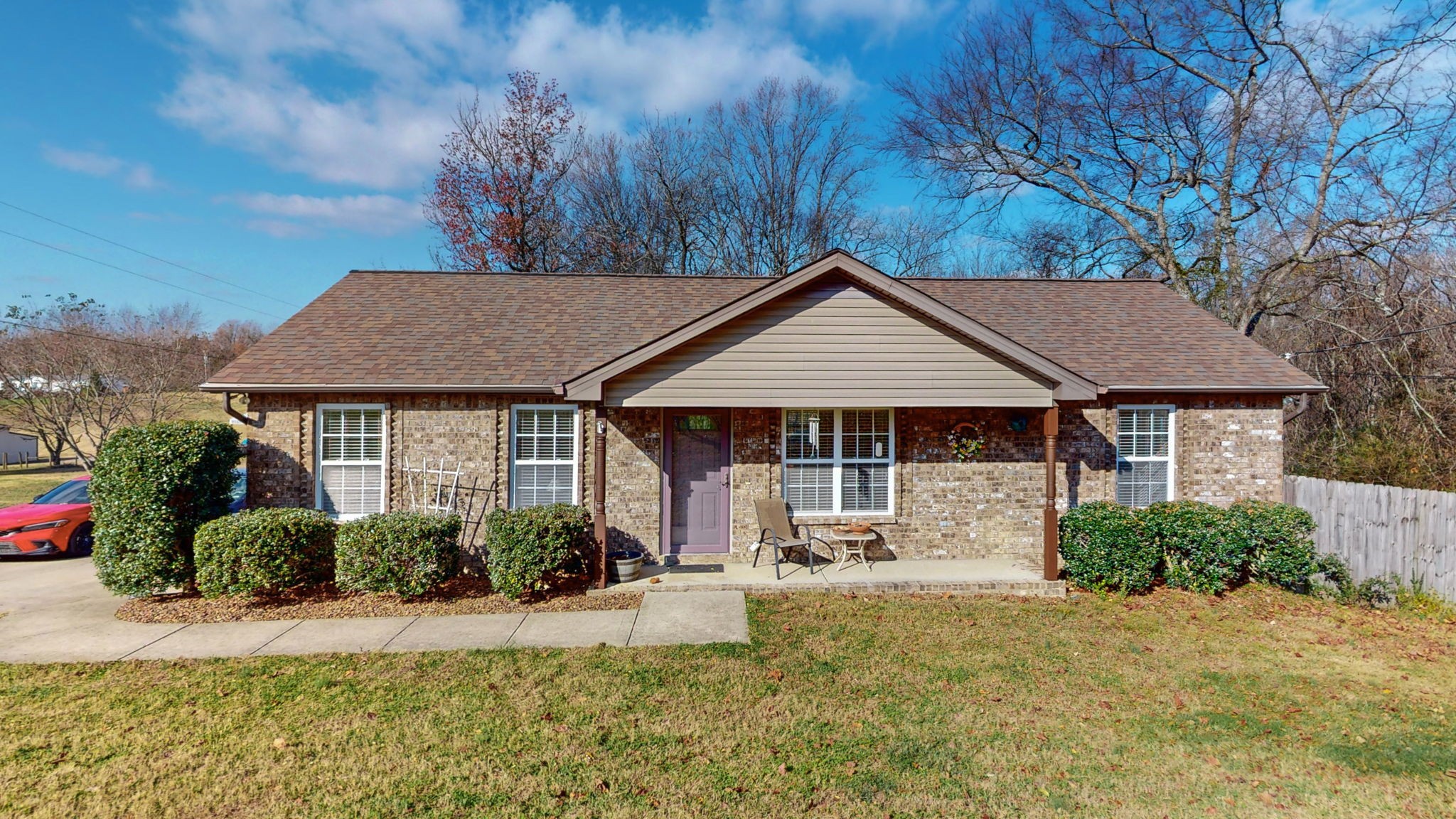 front view of a house with a yard