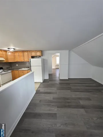 a view of livingroom and hardwood floor