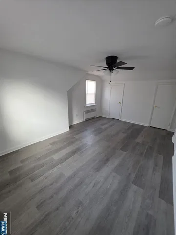 a view of a big room with wooden floor