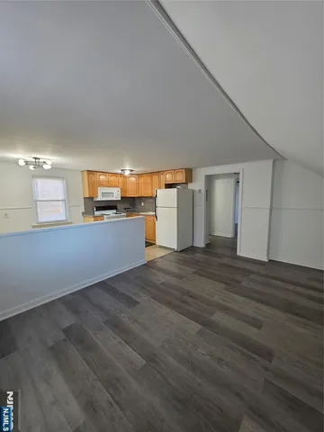 a utility room with cabinets washer and dryer