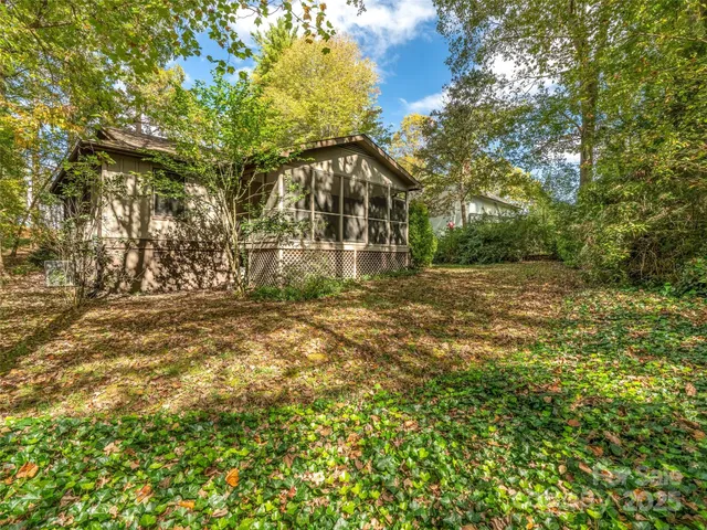 a view of a field with trees